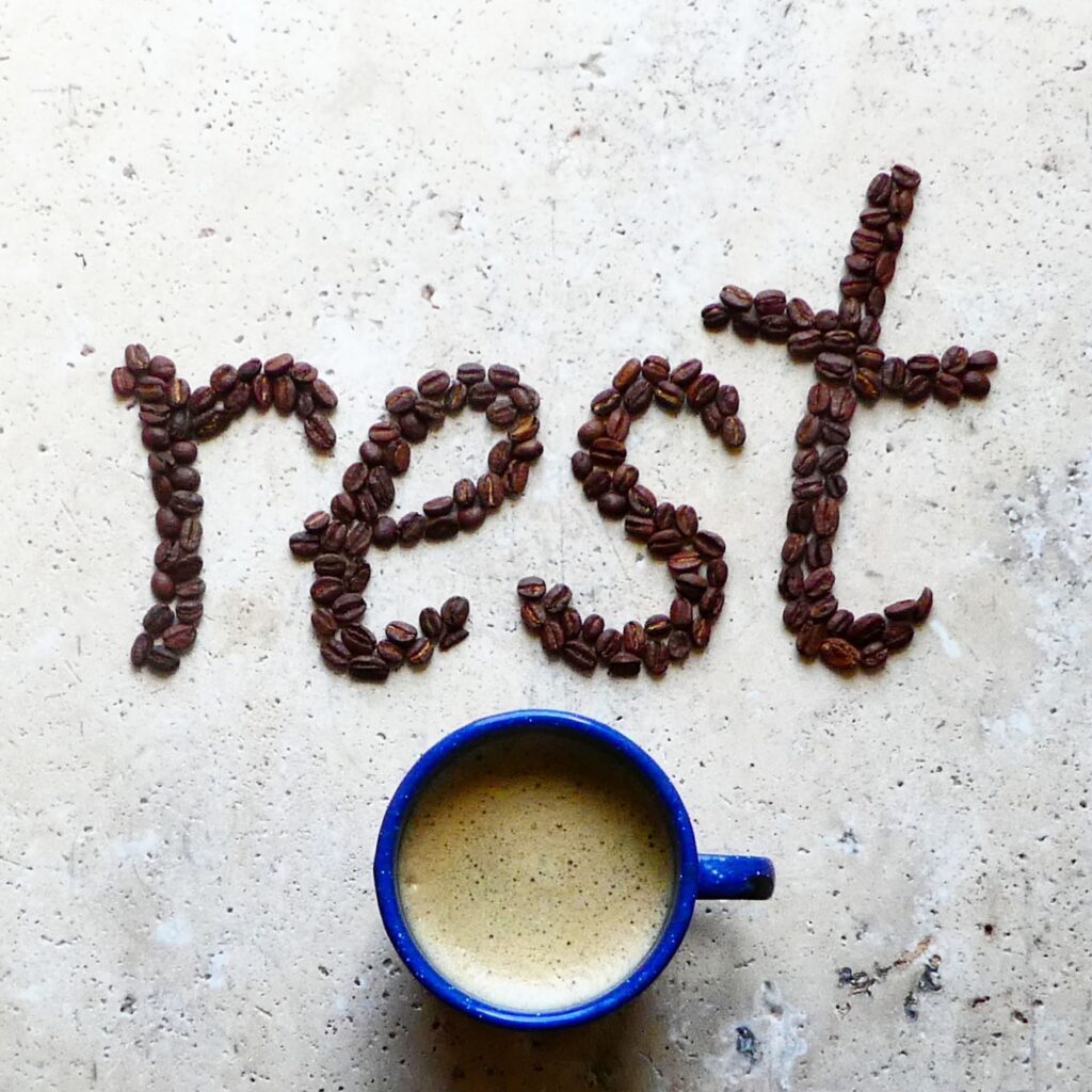 Rest,creative typography made with coffee beans on stone table